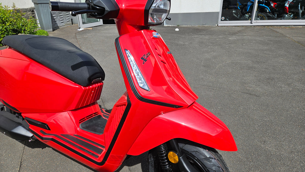X 125